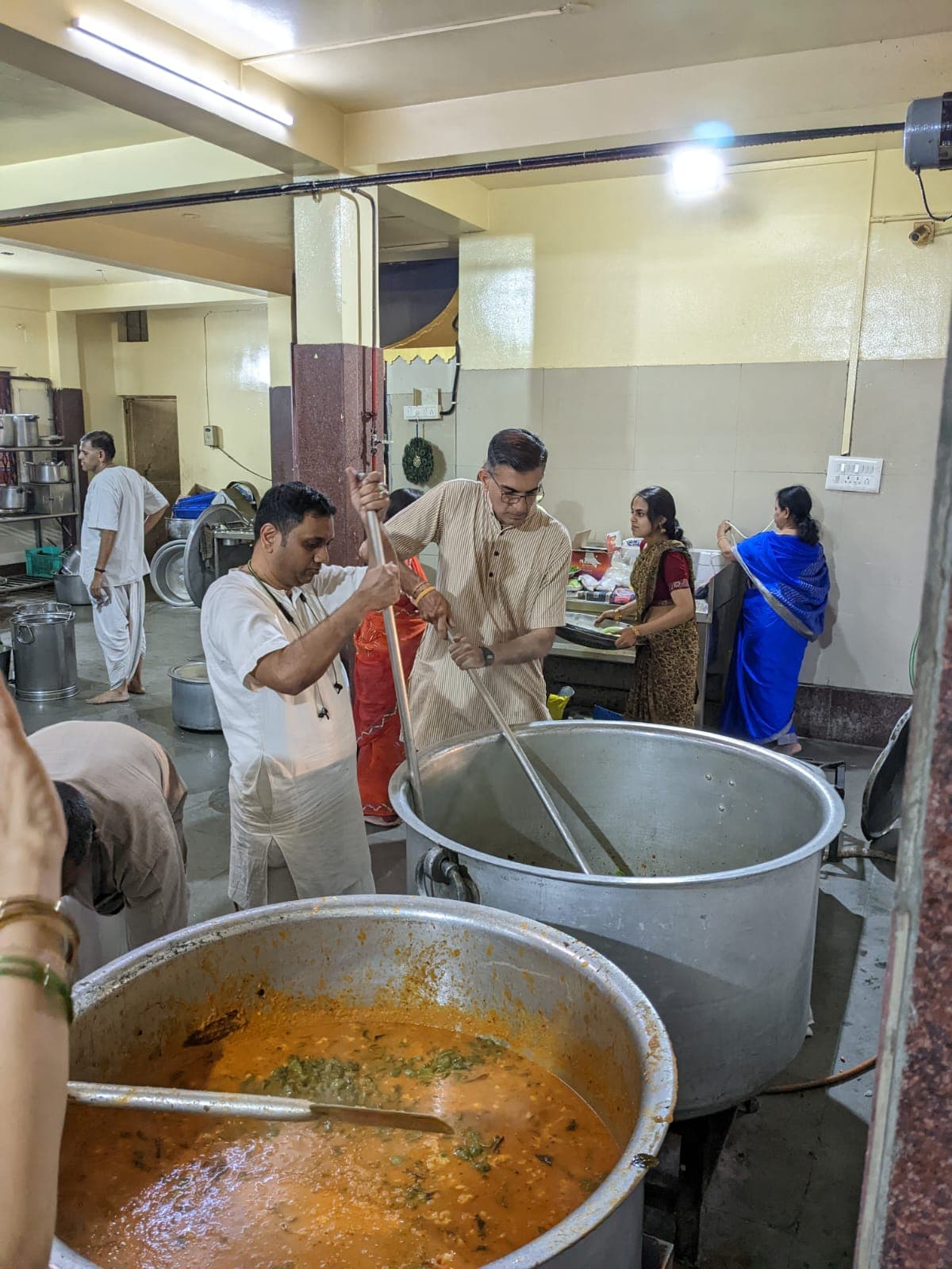 Devotees preparing prasadam