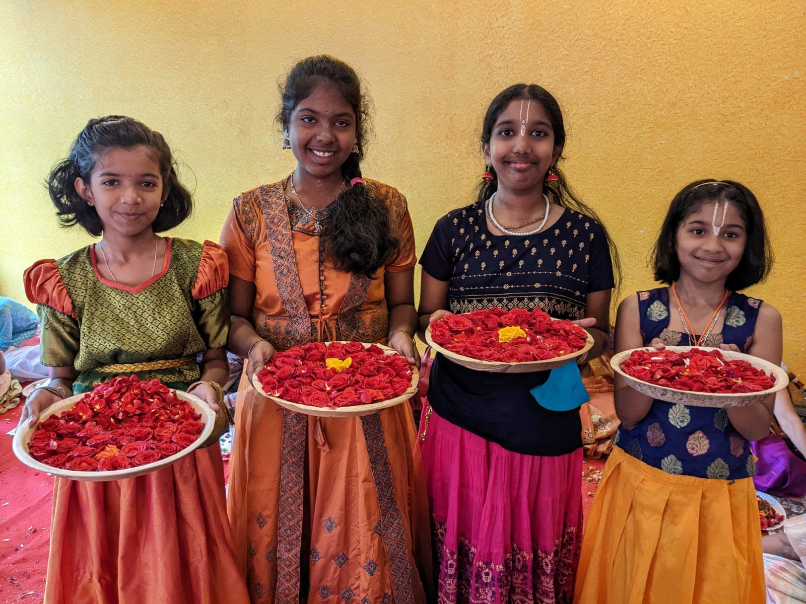 Devotees preparing flower garlands and decorations
