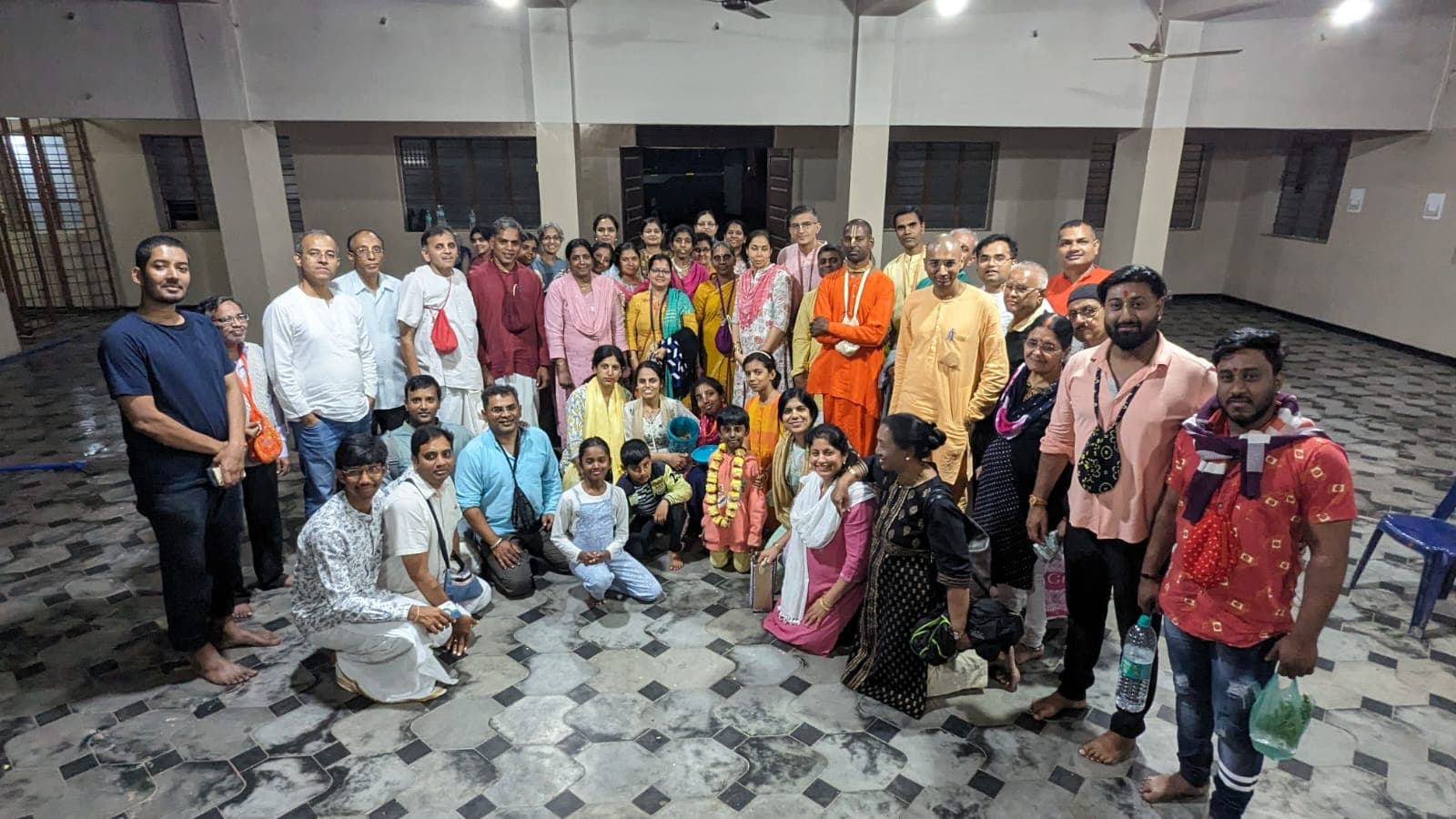 Devotees gathered together after an evening program